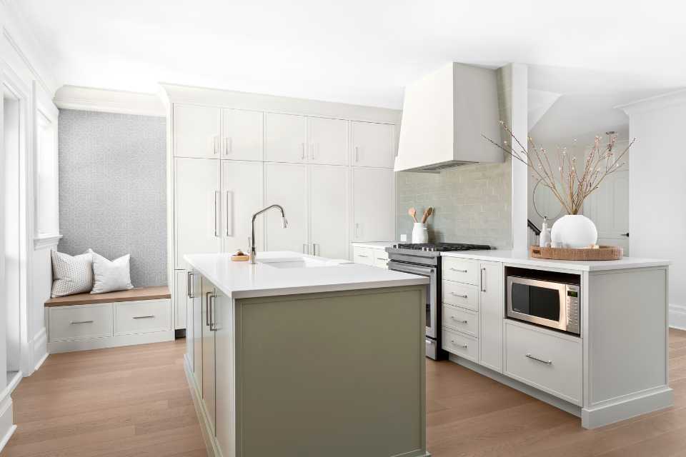 designer kitchen with green island and green tile backsplash